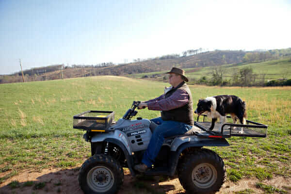 Rogers and a coworker head out into the fields.