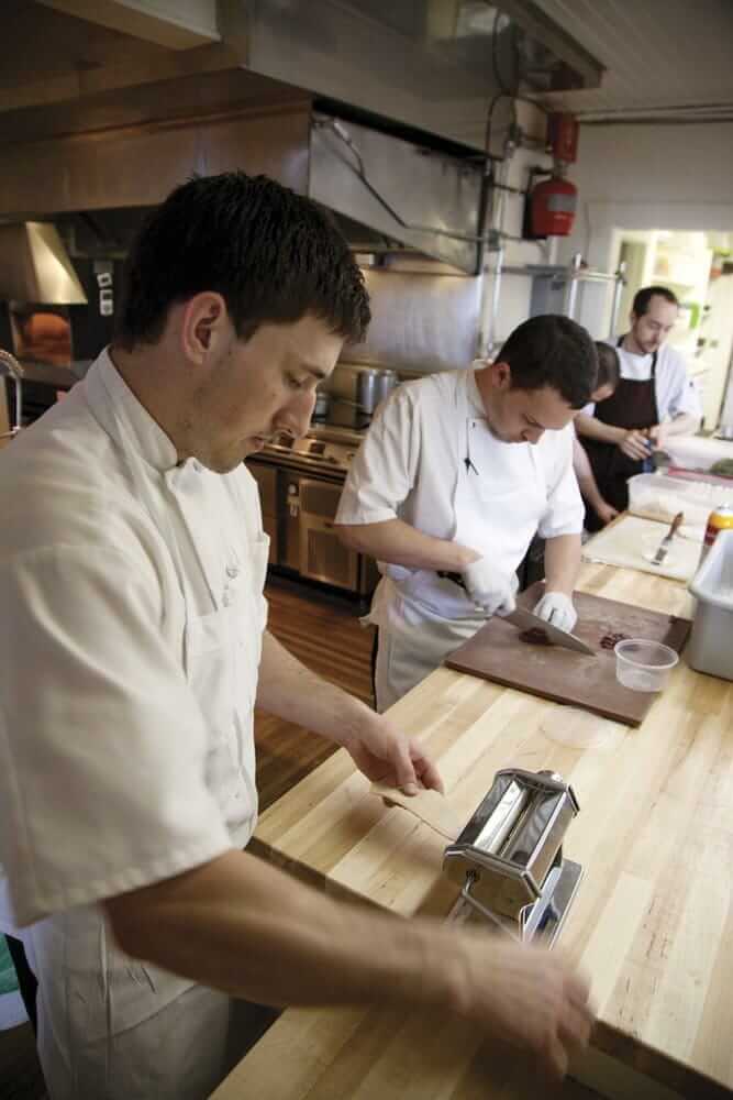 The kitchen at the Willows Inn restaurant, with Chef Blaine Wetzel in foreground