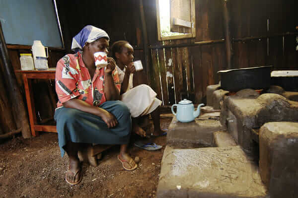 Kenyan women enjoy their farm kitchen makeover.