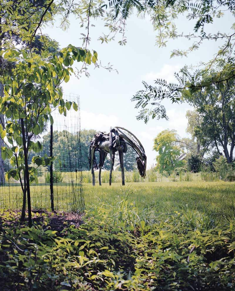 A giant horse, by Deborah Butterfield, looms above the field at Woodland.