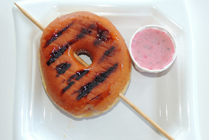 Traditional glazed donut grilled and served with a strawberry mint dipping sauce from Moe & Joe's