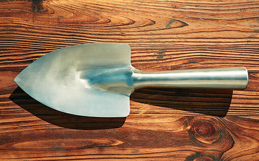 A trio of tools: a seed-planting shovel.