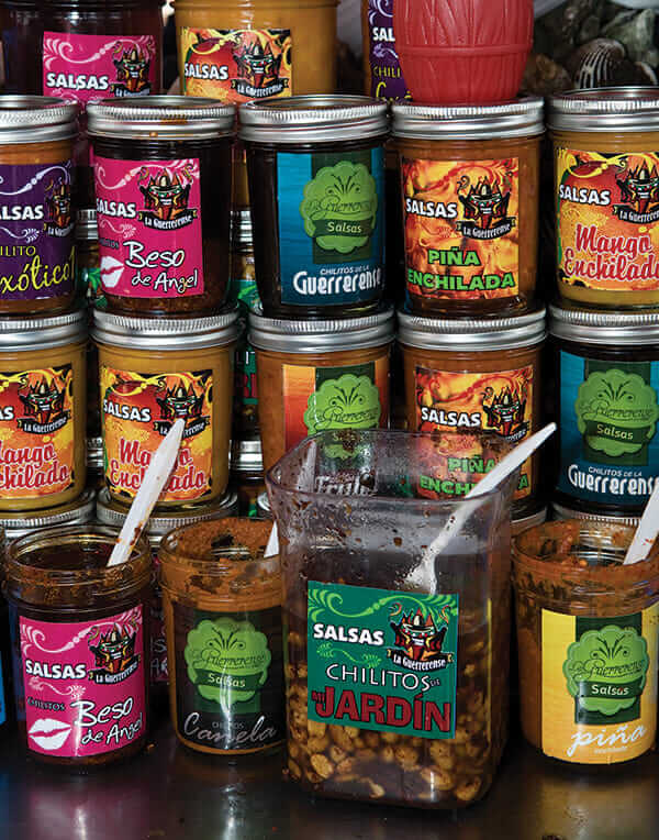 Ingredients in La Guerrerense's colorful salsas include whole peanuts and crushed chiles.