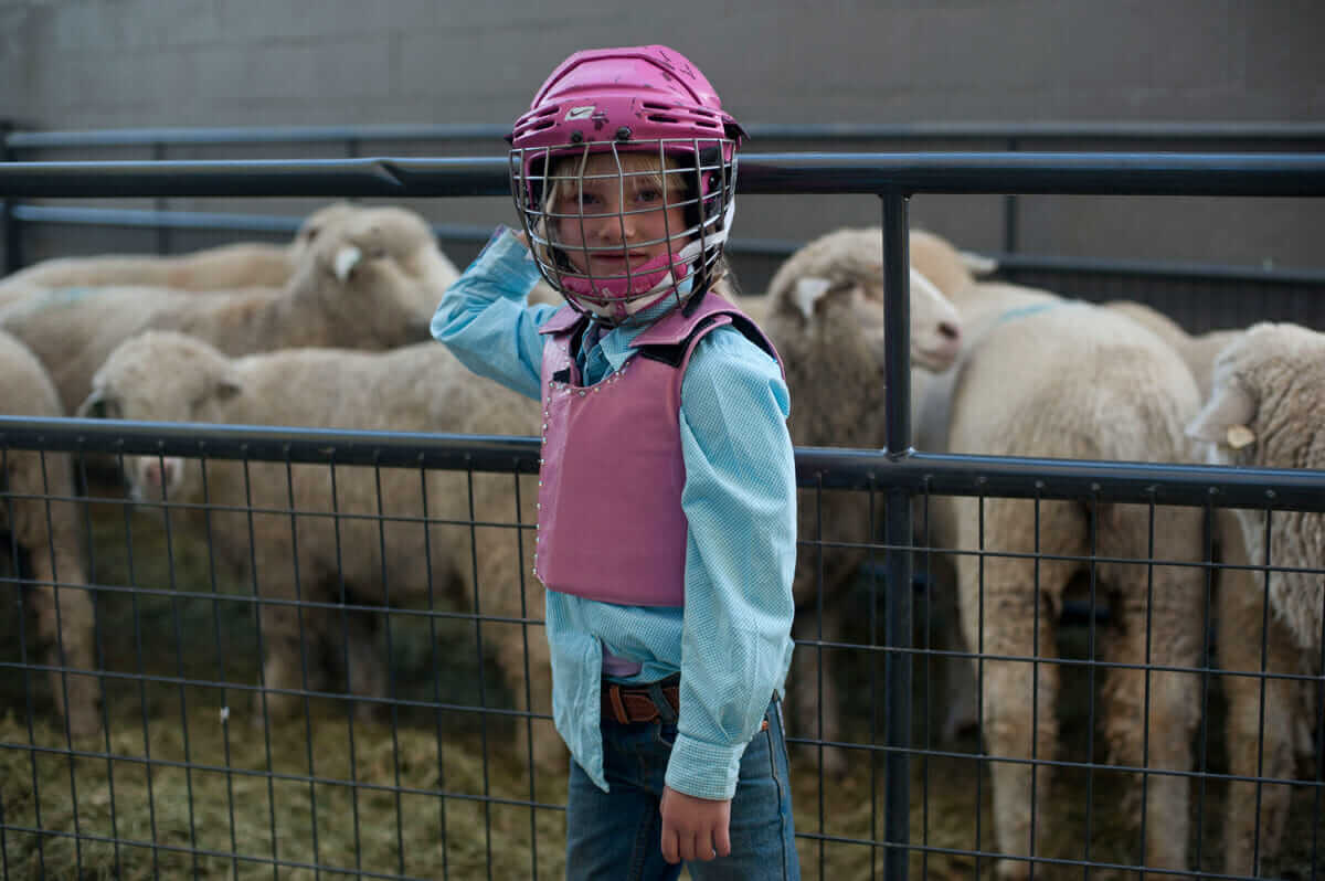 Zoe shows off the official gear worn by all of the riders who participate in the competition. 