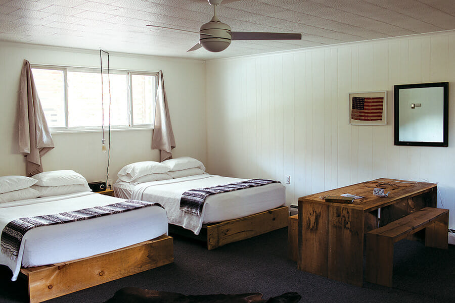 A double deluxe room, where all the furniture was designed and built on the premises with locally sourced, reclaimed wood.