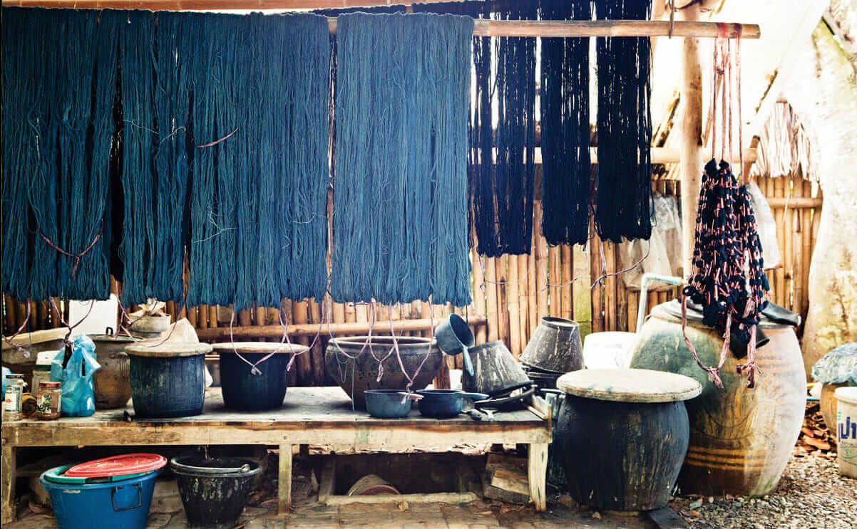 Founded by British textile historian Patricia Cheesman over 20 years ago, Studio Naenna supports local weavers - in part by teaching them new techniques. Here, indigo-dyed fabrics dry.