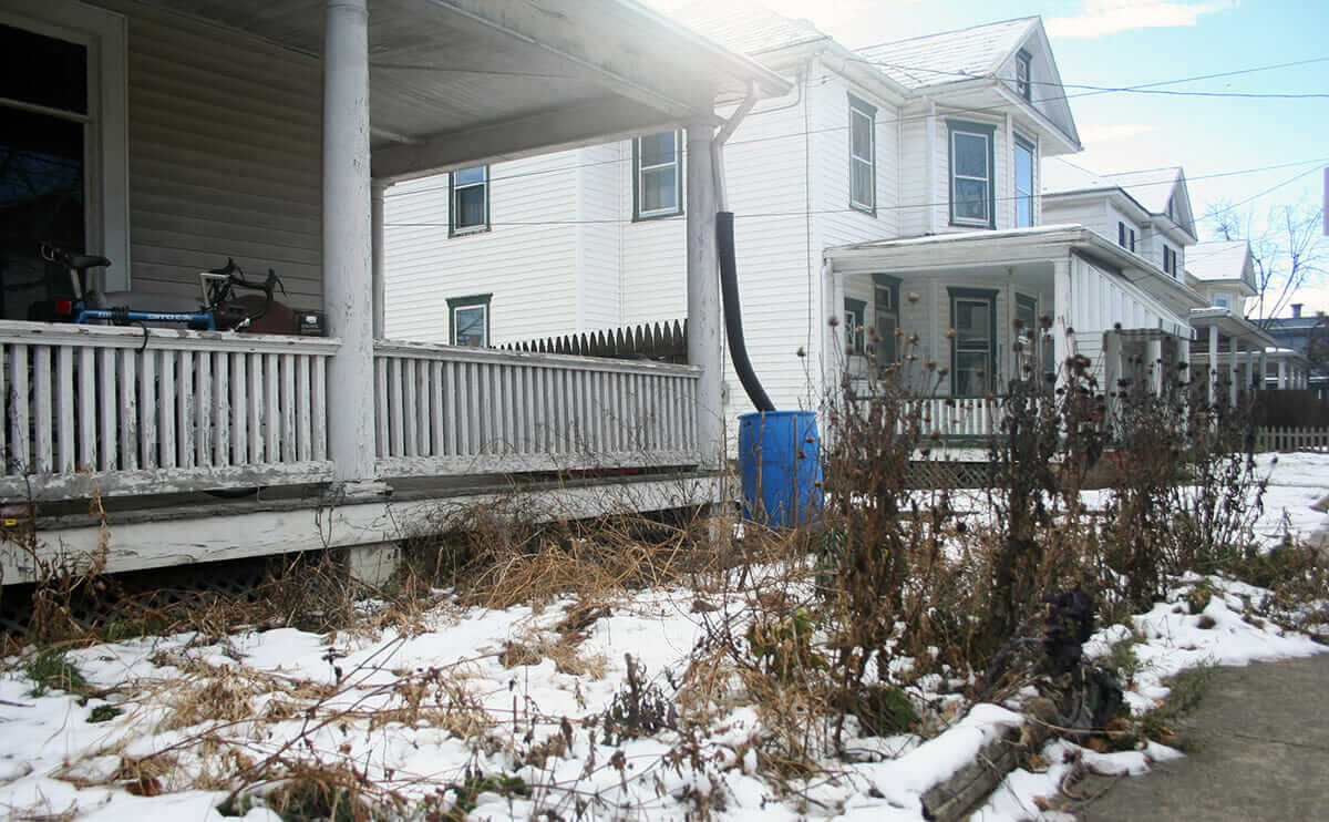 The front section of the farm, a several-foot strip between the porch and the sidewalk.