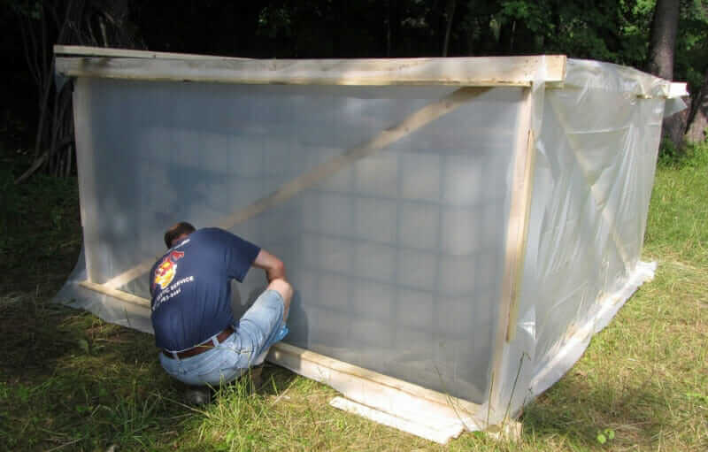 A greenhouse built to treat urine tanks for pathogens. The urine is sanitized after 30 days at or above 20°C (68°F).