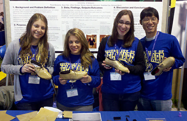 University of Delaware students show off a shoe made with chicken feathers, natural fibers and soybeans. / Credit: Richard Wool, University of Delaware