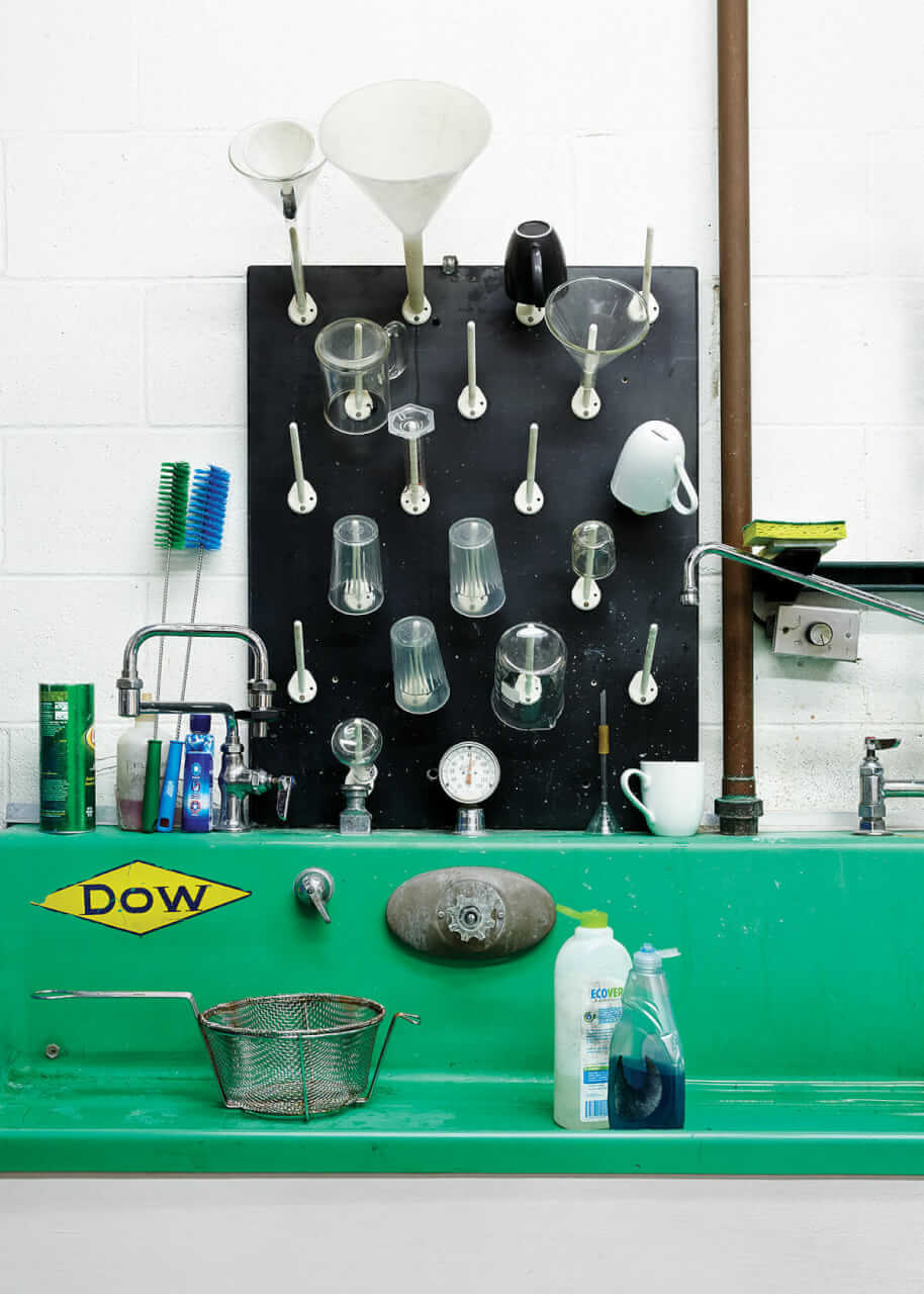 The glass-washing sink with glassware drying rack above. The sink was originally used for photographic developing.