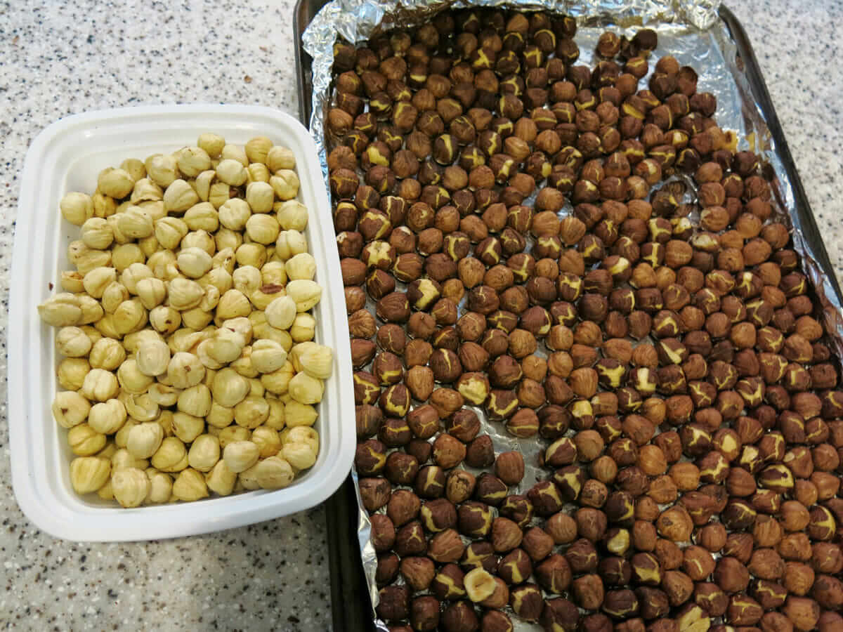 Roasted hazelnuts before and after being rubbed to remove pellicle.