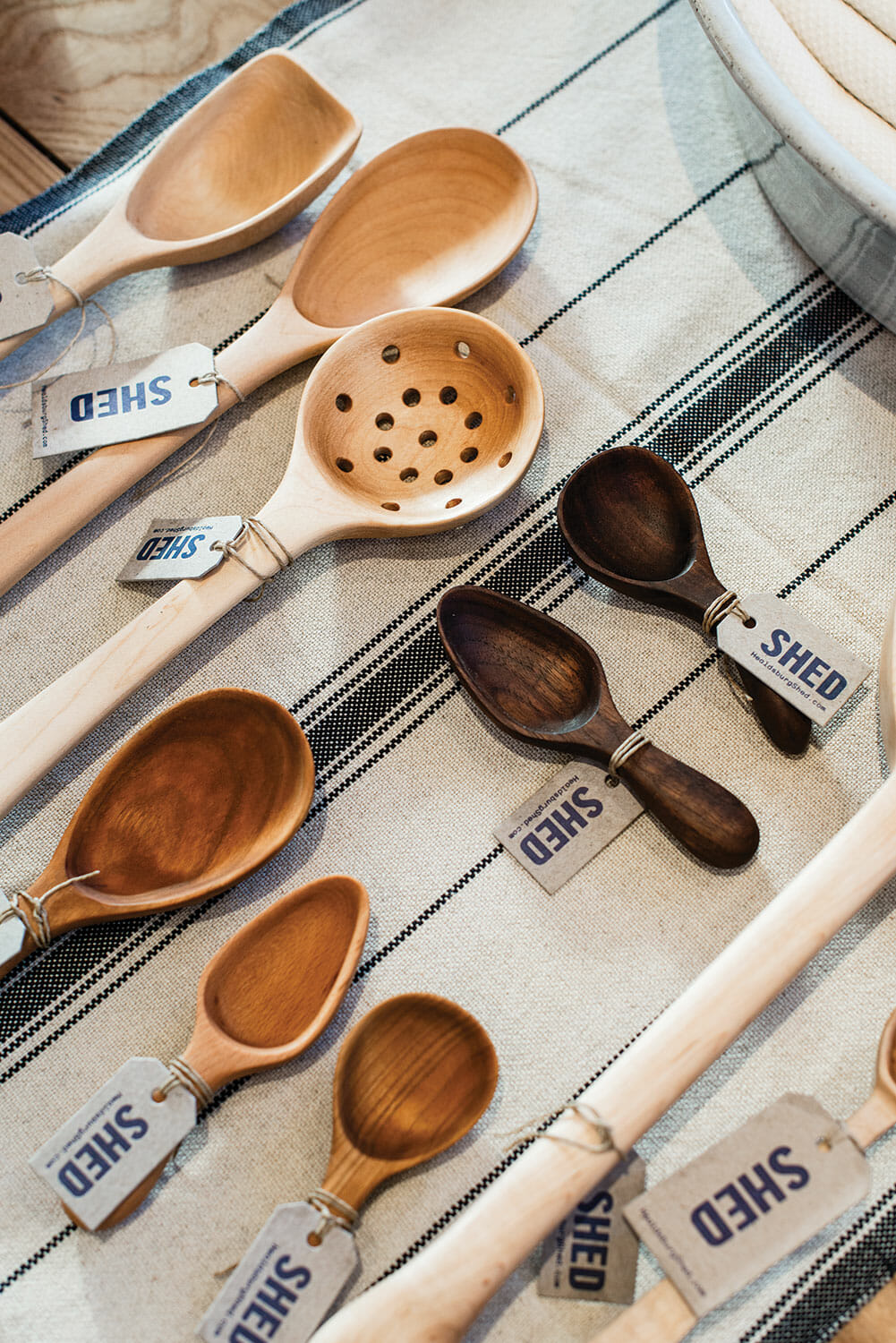 The housewares section focuses on handcrafted tools, such as these hardwood spoons and scoops made by a California woodworker.