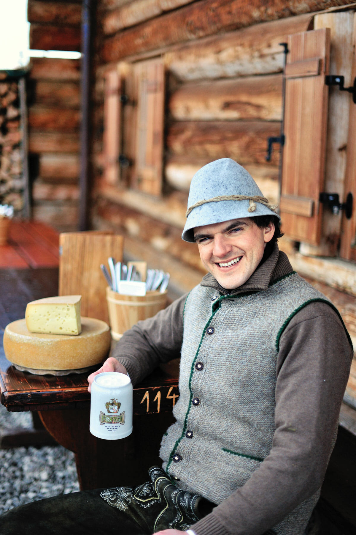 Chef Franz Mulser wearing his traditional felt hat and lederhosen. His kitchen, where he works with two sous chefs, is roughly the size of a closet.