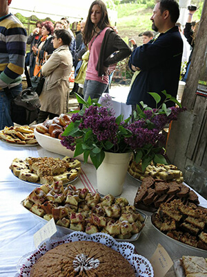 A guest sneaking a peak at the food, while listening to announcements.