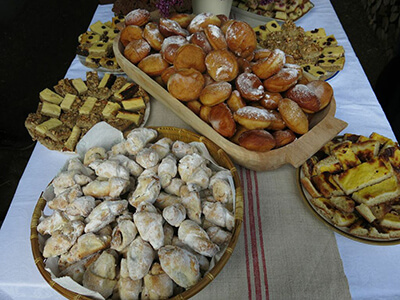 Doughnuts, crescent cookies similar to rugelach, and other desserts rounded out the meal.