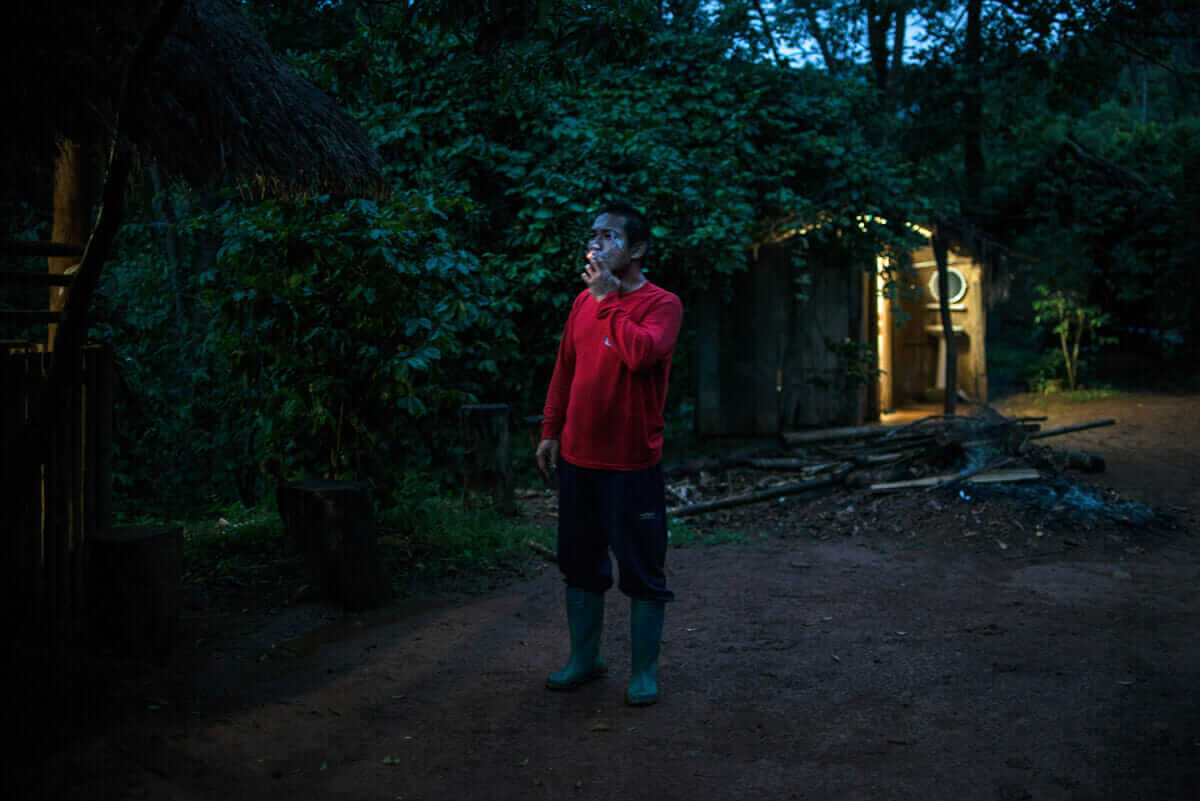 A farm laborer takes an evening smoke.