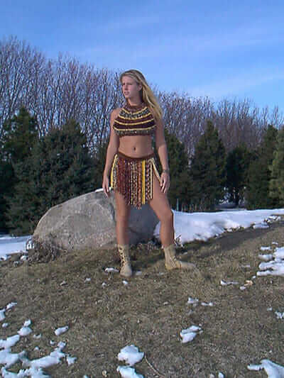 Heidi Scott's daughter, Inga, models a corn necklace, corn bra and loin corn skirt.