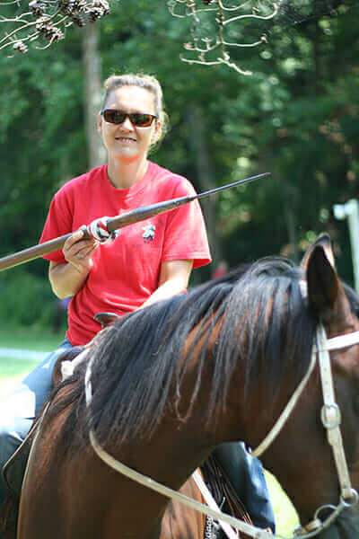 The Maid of Velvet Touch, or Chrissy Groah, poses with her lance atop Ricochet, an 18-year-old gelding Tennessee Walker and Arabian mix.