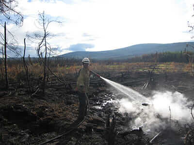 KT Scheer on the scene of a forest fire in Alaska.