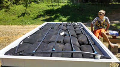 Some of the BroGro basics: table, growing medium and an irrigation system.