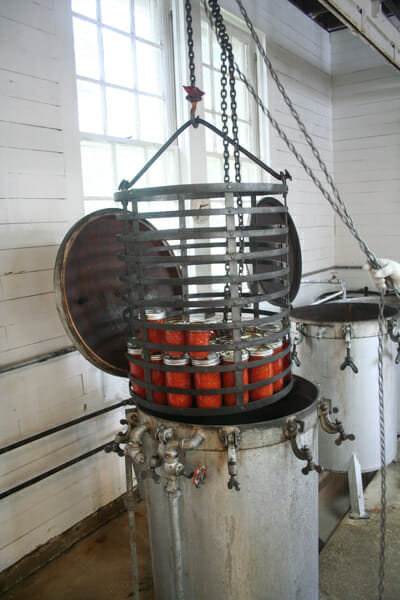Far larger than a stove-top pressure cooker, the ones at the Keezletown Community Cannery are loaded with a chain hoist.