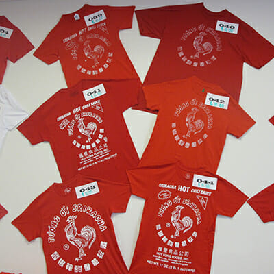Sriracha tee shirts for sale in The Rooster Room.