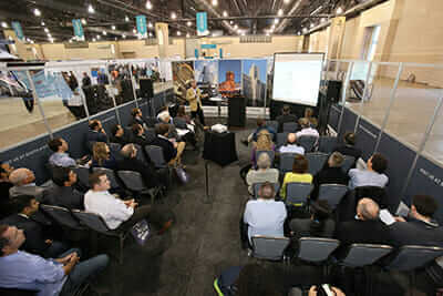 A speaker presents in one of the conference's Education Labs located on the expo floor. / Courtesy Greenbuild Expo.