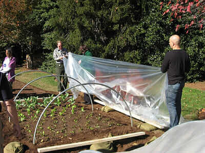 Kass helps assemble high tunnels for the White House garden. / Courtesy the White House.