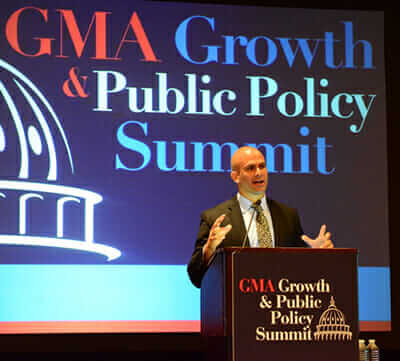 Sam Kass speaking at the Grocery Manufacturers Association Growth and Public Policy Summit. / Courtesy the White House 