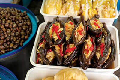 Pickled eggplant and other local snacks at the Pazari i Ri (