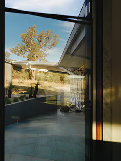 Double glazed windows help regulate the house's temperature (and offer nice views).