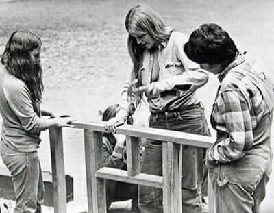 Staff at Country Women magazine learn to frame a building. / Courtesy Sally Bailey.