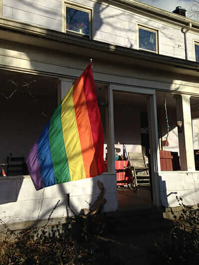 A rainbow flag flies in front of Gael and Charoula's Ohio farmhouse. / Courtesy Bill Schaffer.