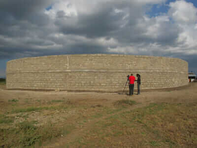 The masonry wall was built from locally-sourced materials.