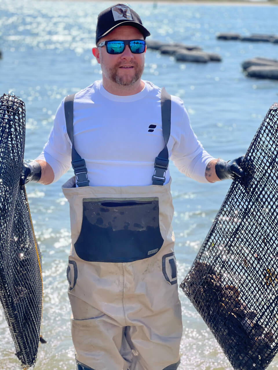 Person holding oyster cages