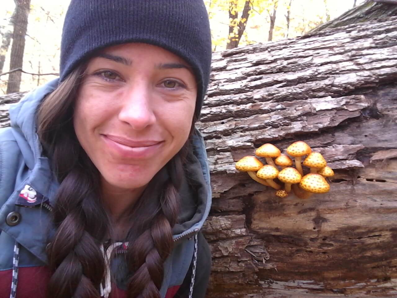 Andi Bruce stands in front of mushrooms