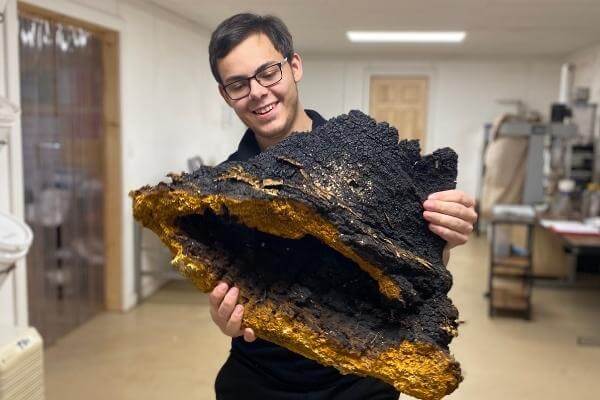 Garrett Kopp with foraged chaga.