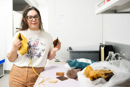 Asiah Brazil-Geyshick holds a leather moccasin and kombucha leather she made.
