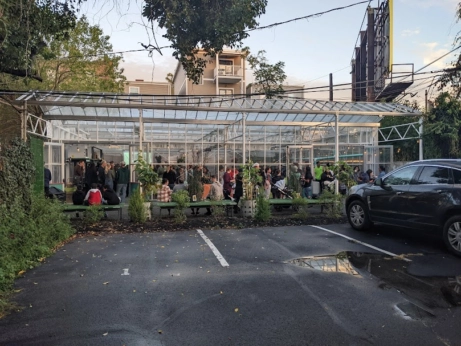 A greenhouse full of people.