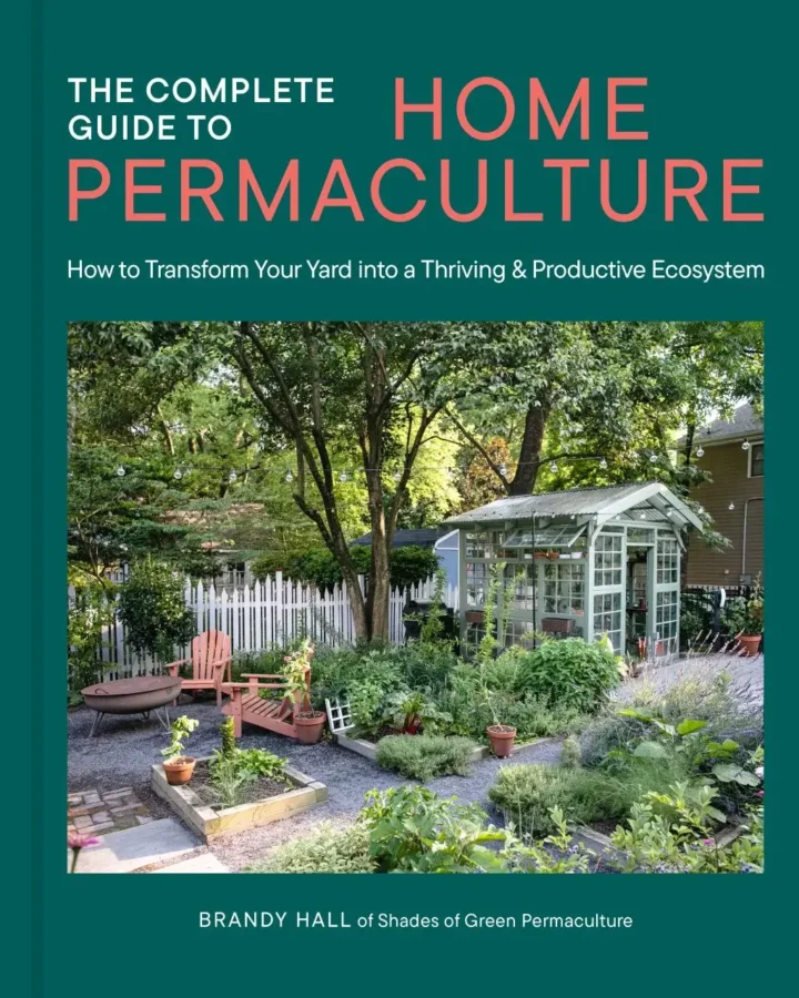 Cover if the book The Complete Guide To Home Permaculture, having a green color and a photo of a garden with a green house
